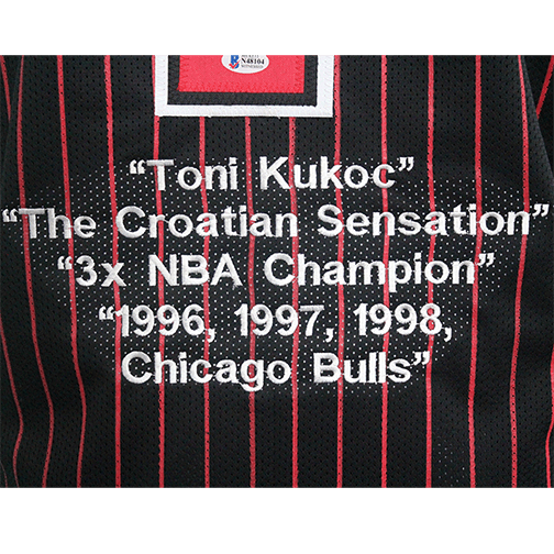 Toni Kukoc Autographed Basketball Jersey Black Pinstripe w/ STATS! (Beckett) - RSA